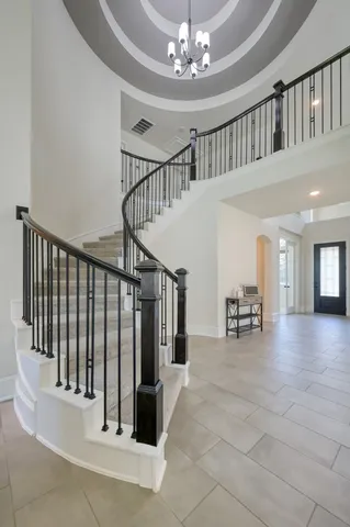 a view of entryway and hall with dining room