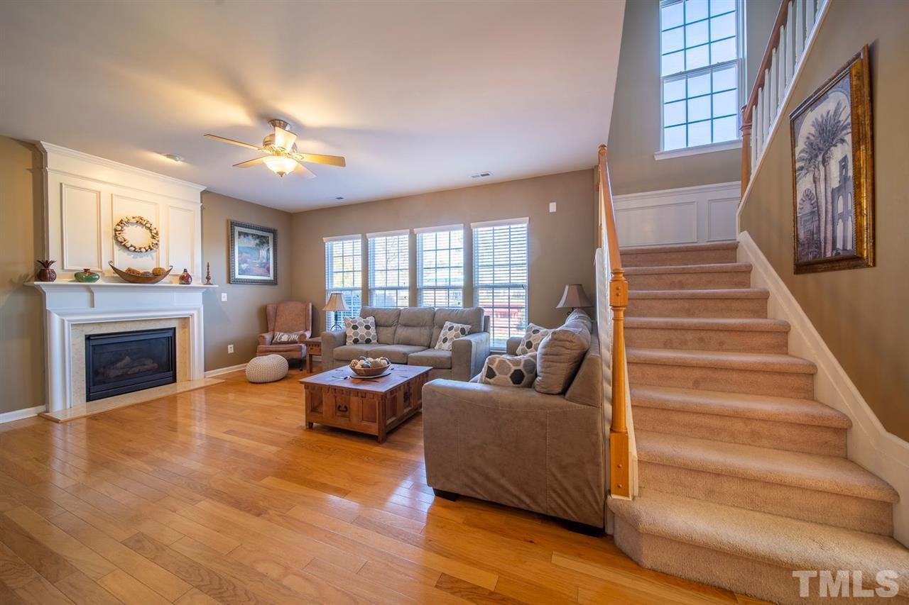 3314 Colorcott Street Raleigh, NC 27614 - Photo 6 of 12 a living room with furniture and a fireplace
