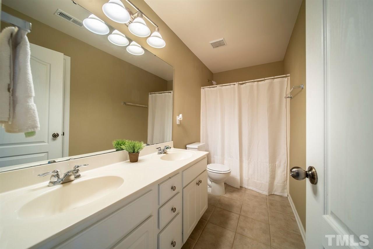 3314 Colorcott Street Raleigh, NC 27614 - Photo 9 of 12 a bathroom with a double vanity sink mirror and double