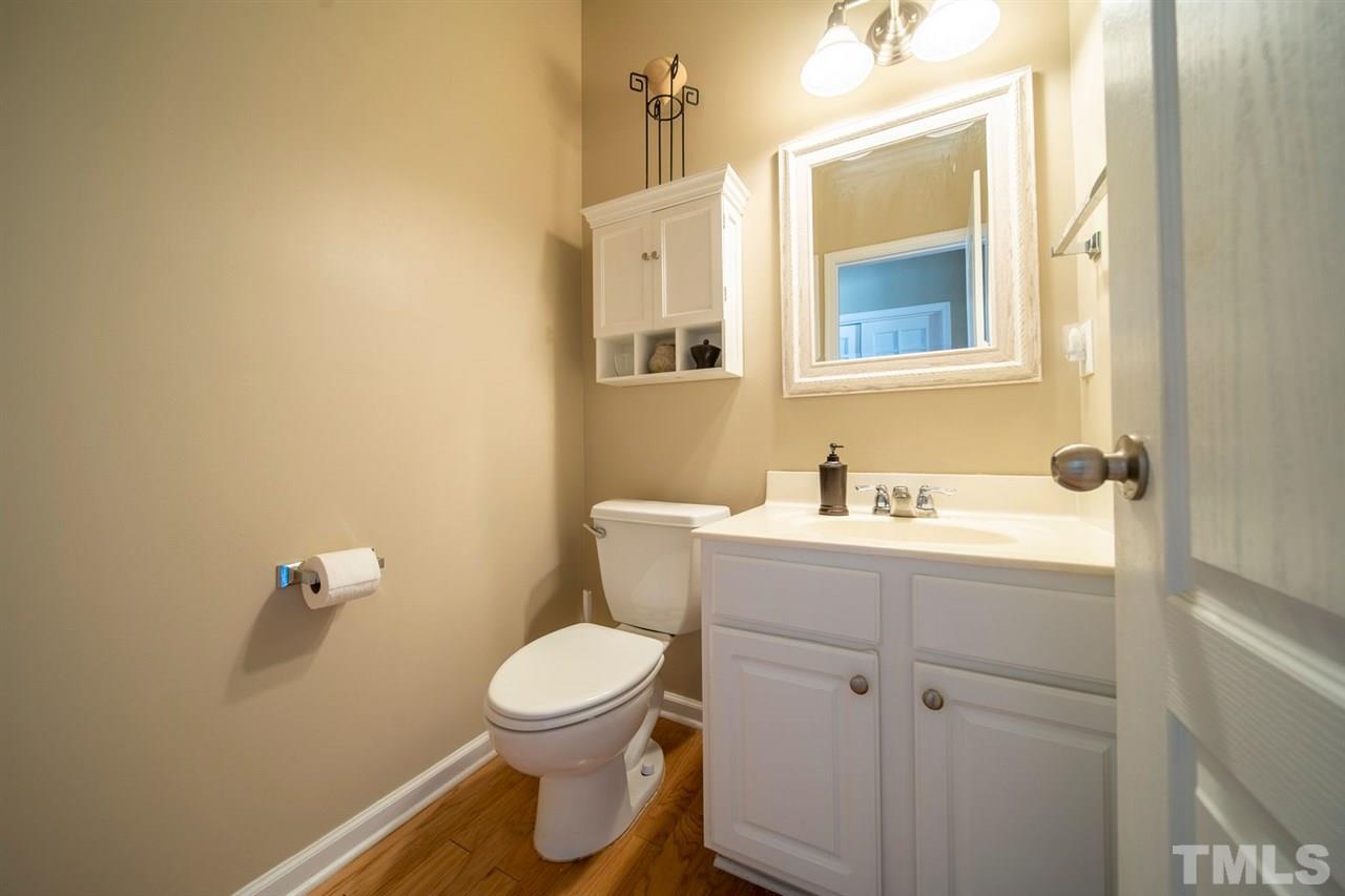3314 Colorcott Street Raleigh, NC 27614 - Photo 10 of 12 a bathroom with a toilet sink and mirror