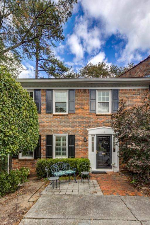 4545 Wieuca Road Northeast, Unit 16 Atlanta, GA 30342 - Photo 1 of 1 front view of house with a yard