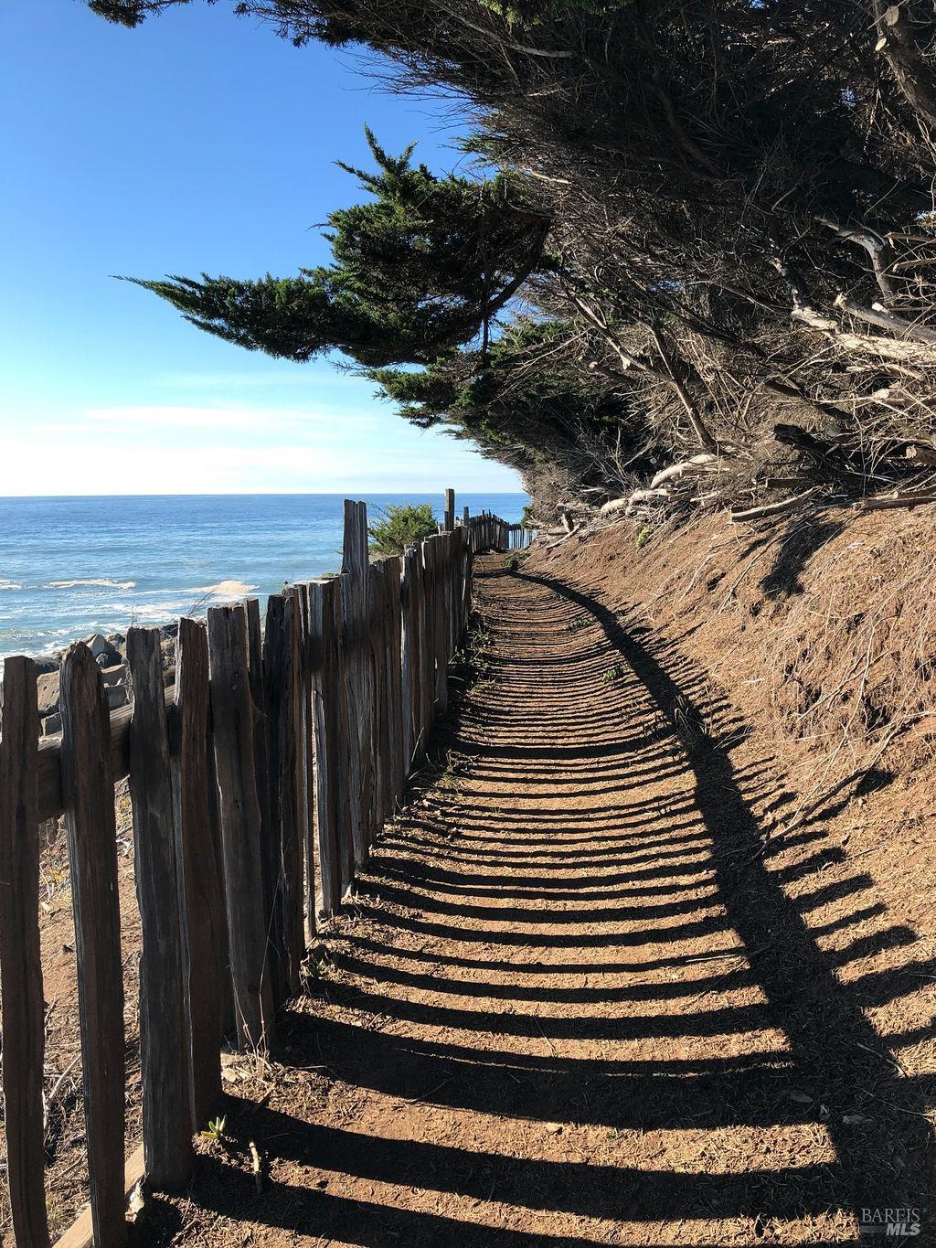 42179 Rock Cod The Sea Ranch, CA 95497 - Photo 24 of 28 a view of a balcony with wooden floor and fence