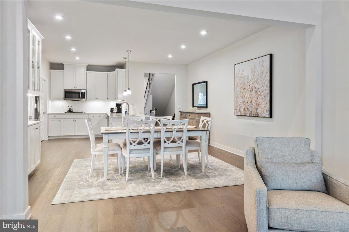 34 Griffin Way Yardley, PA 19067 - Photo 12 of 50 a dining room with kitchen island stainless steel appliances kitchen island granite countertop a dining table chairs and view living room