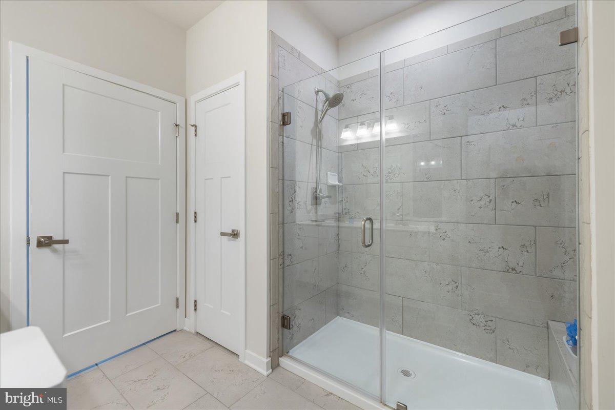 34 Griffin Way Yardley, PA 19067 - Photo 22 of 50 a bathroom that has a glass shower door