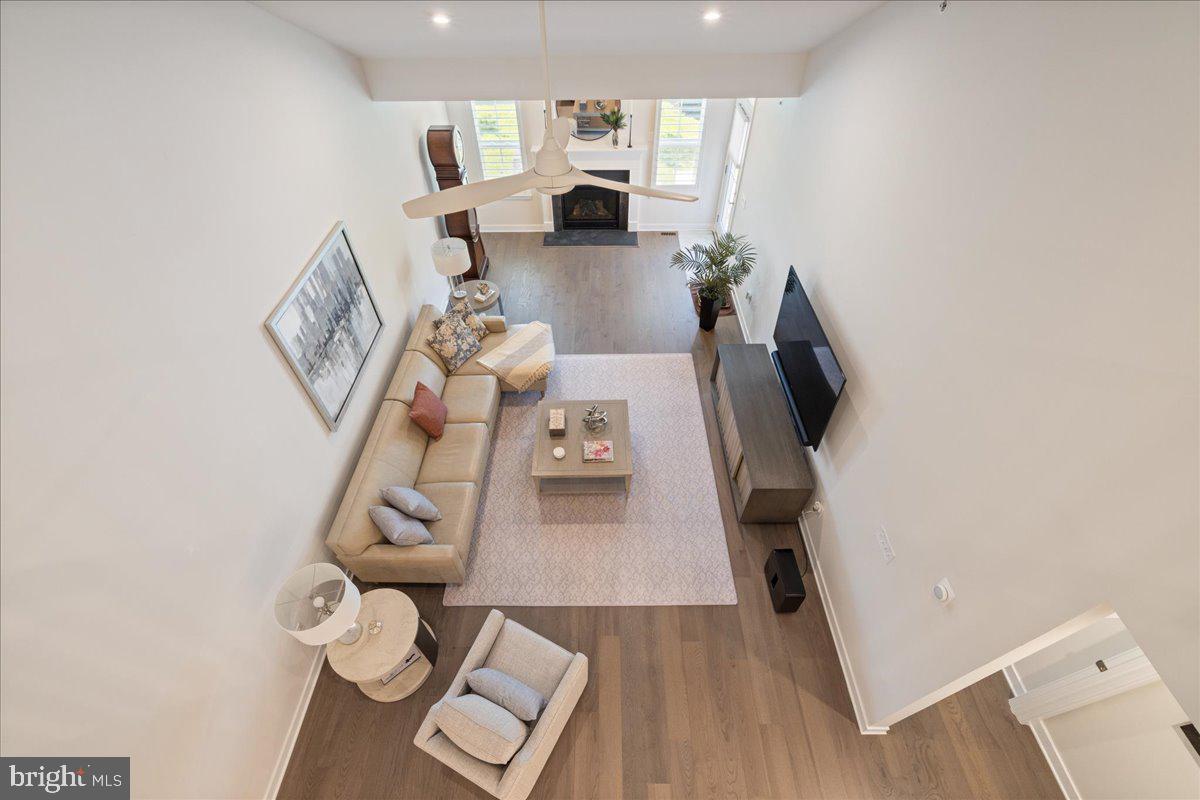 34 Griffin Way Yardley, PA 19067 - Photo 29 of 50 walk in closet with wooden floor and living room