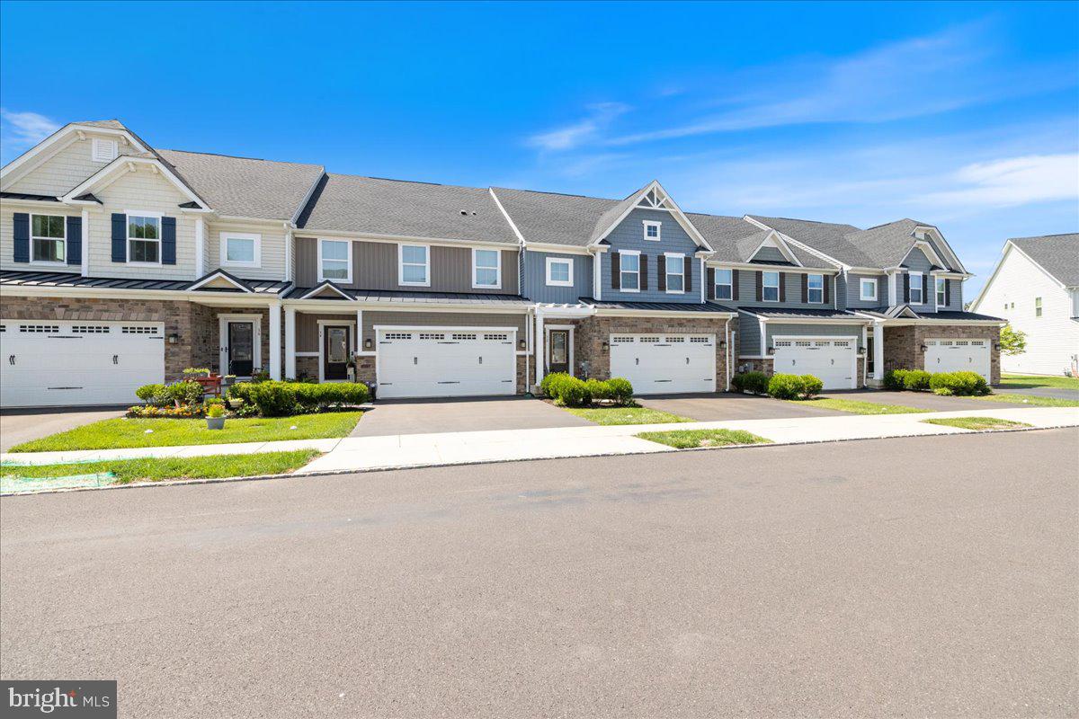 34 Griffin Way Yardley, PA 19067 - Photo 3 of 50 a front view of a house with a big yard