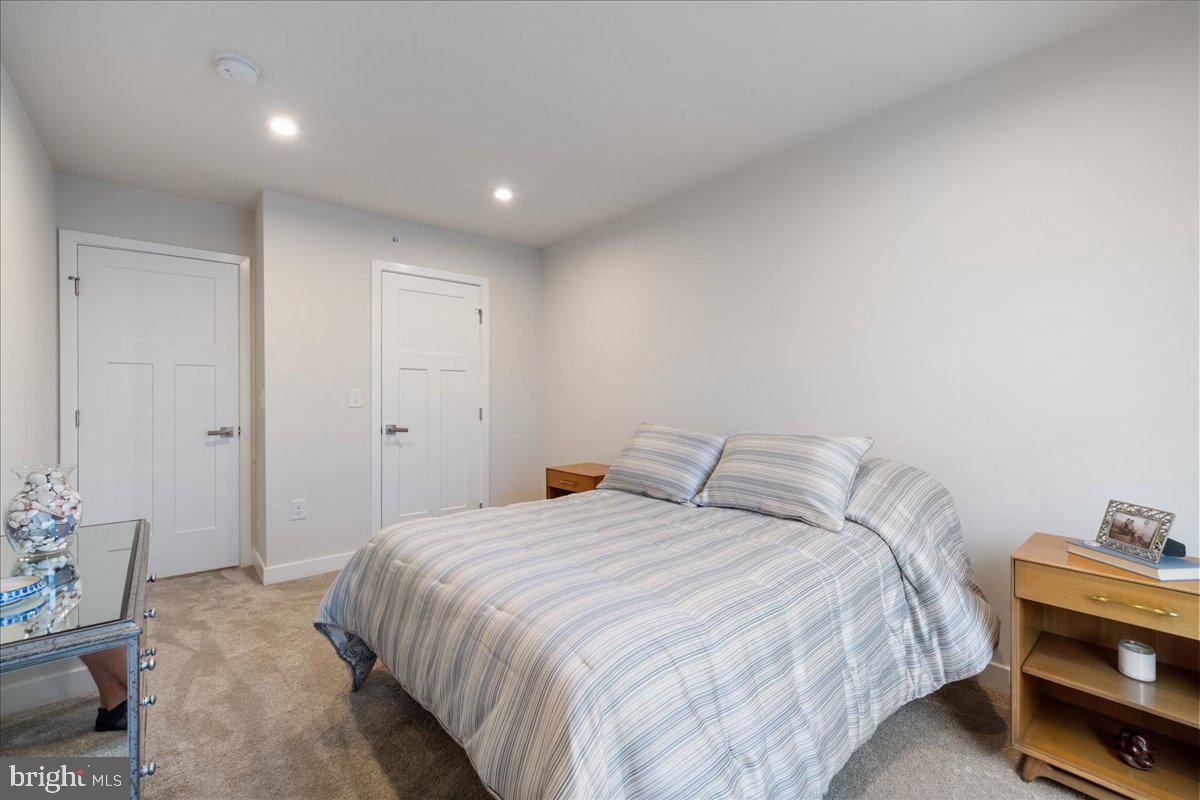34 Griffin Way Yardley, PA 19067 - Photo 31 of 50 a bedroom with a bed and a potted plant on the dresser