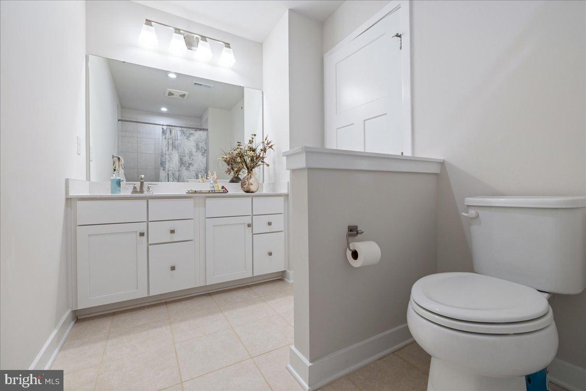 34 Griffin Way Yardley, PA 19067 - Photo 33 of 50 a bathroom with a toilet a sink a vanity and mirror