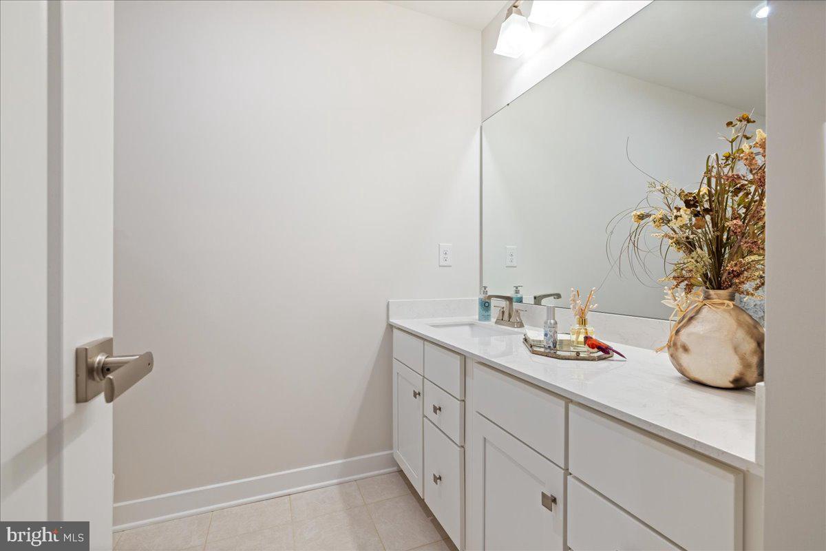 34 Griffin Way Yardley, PA 19067 - Photo 34 of 50 a bathroom with a granite countertop sink and a mirror