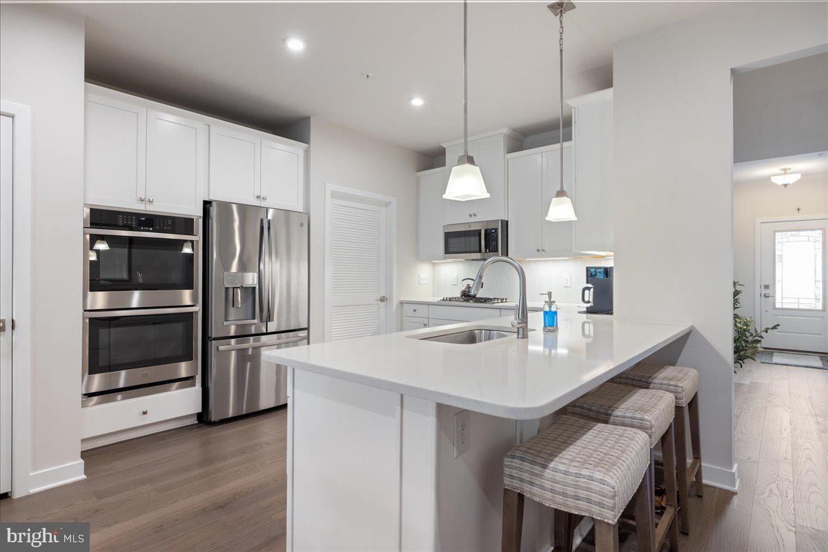 34 Griffin Way Yardley, PA 19067 - Photo 8 of 50 a kitchen with a refrigerator a sink and a stove