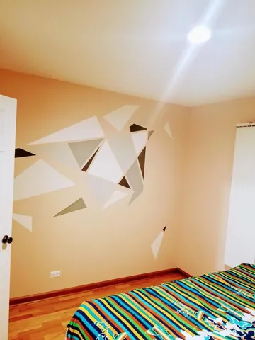 a bedroom with a bed and a book shelf