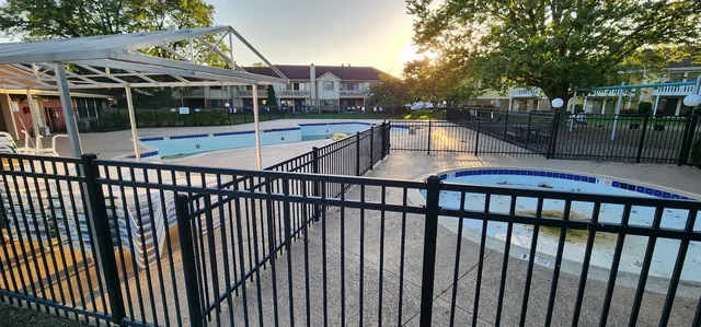 a view of houses with a swimming pool