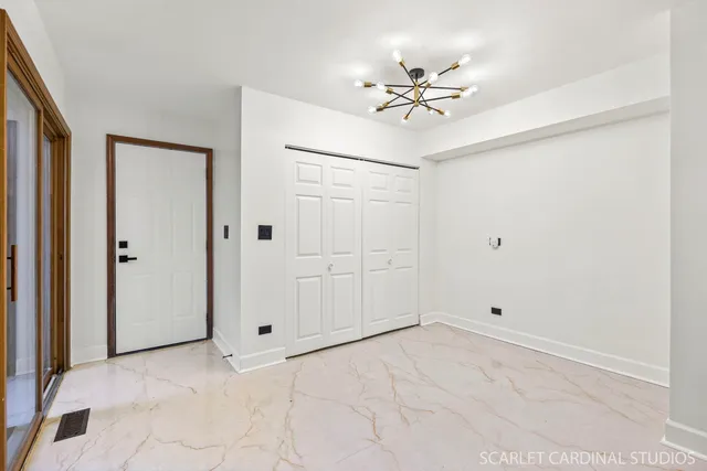 a kitchen with stainless steel appliances a refrigerator a sink and wooden cabinets
