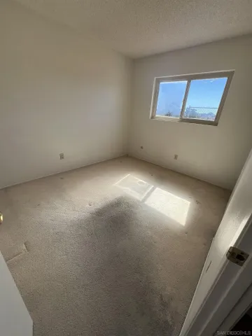 a view of empty room with windows