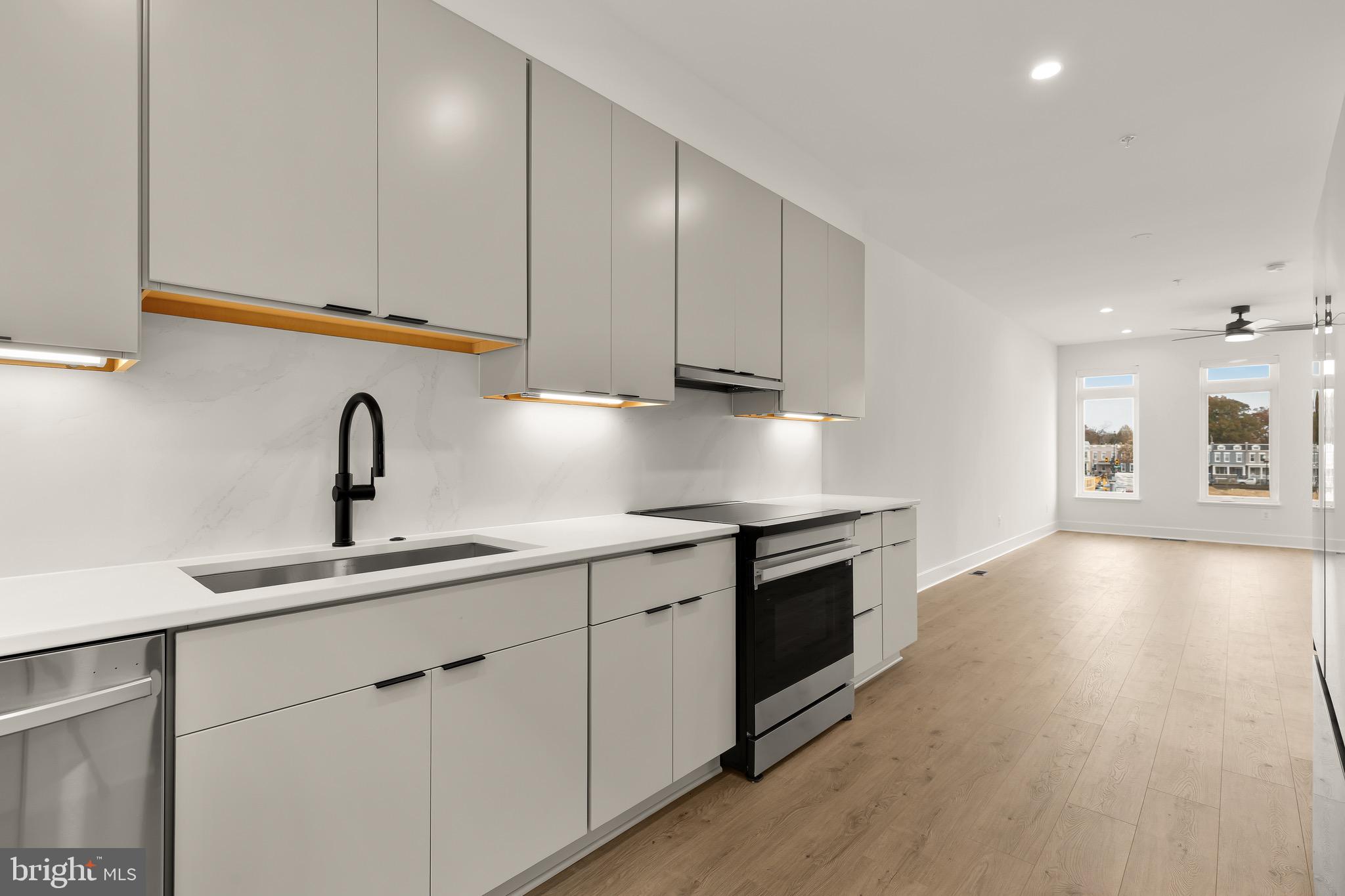 2608 Olmsted Court Northwest Washington, DC 20422 - Photo 13 of 39 a kitchen with a sink cabinets and stainless steel appliances