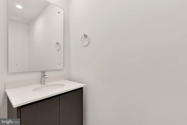 a view of a room with wooden floor and window