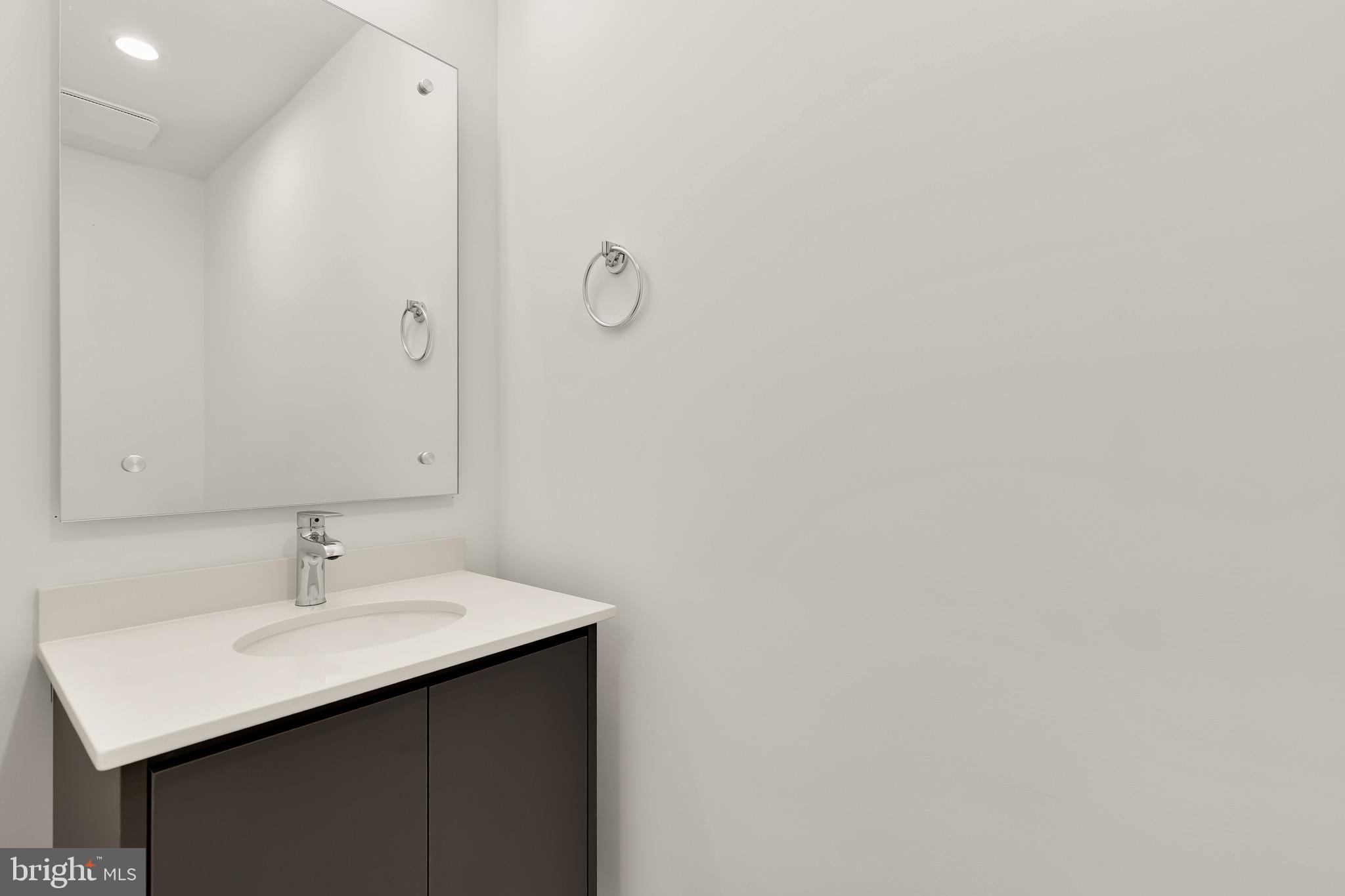 2608 Olmsted Court Northwest Washington, DC 20422 - Photo 16 of 39 a bathroom with a sink and a mirror