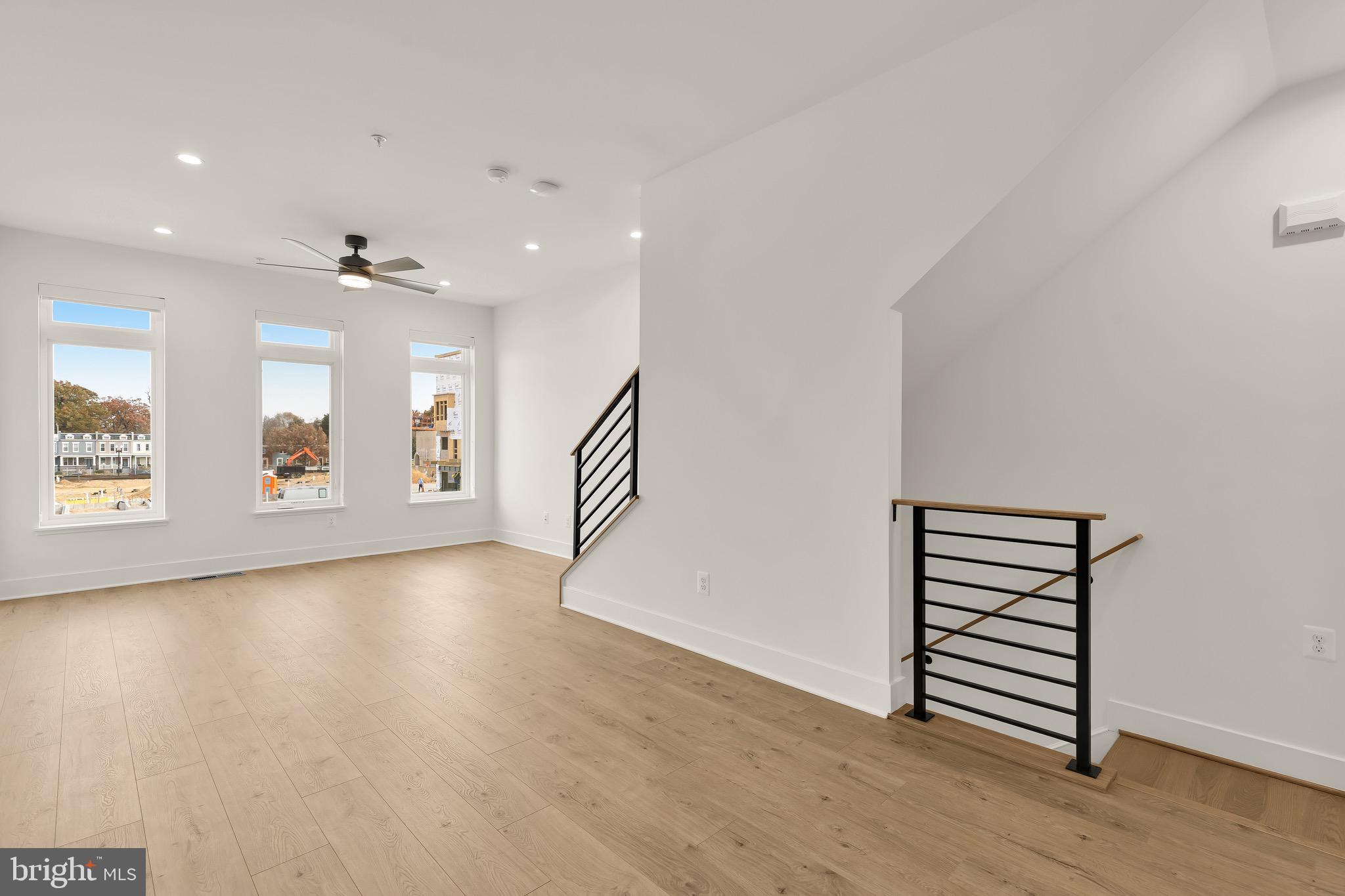 2608 Olmsted Court Northwest Washington, DC 20422 - Photo 19 of 39 an empty room with wooden floor and windows