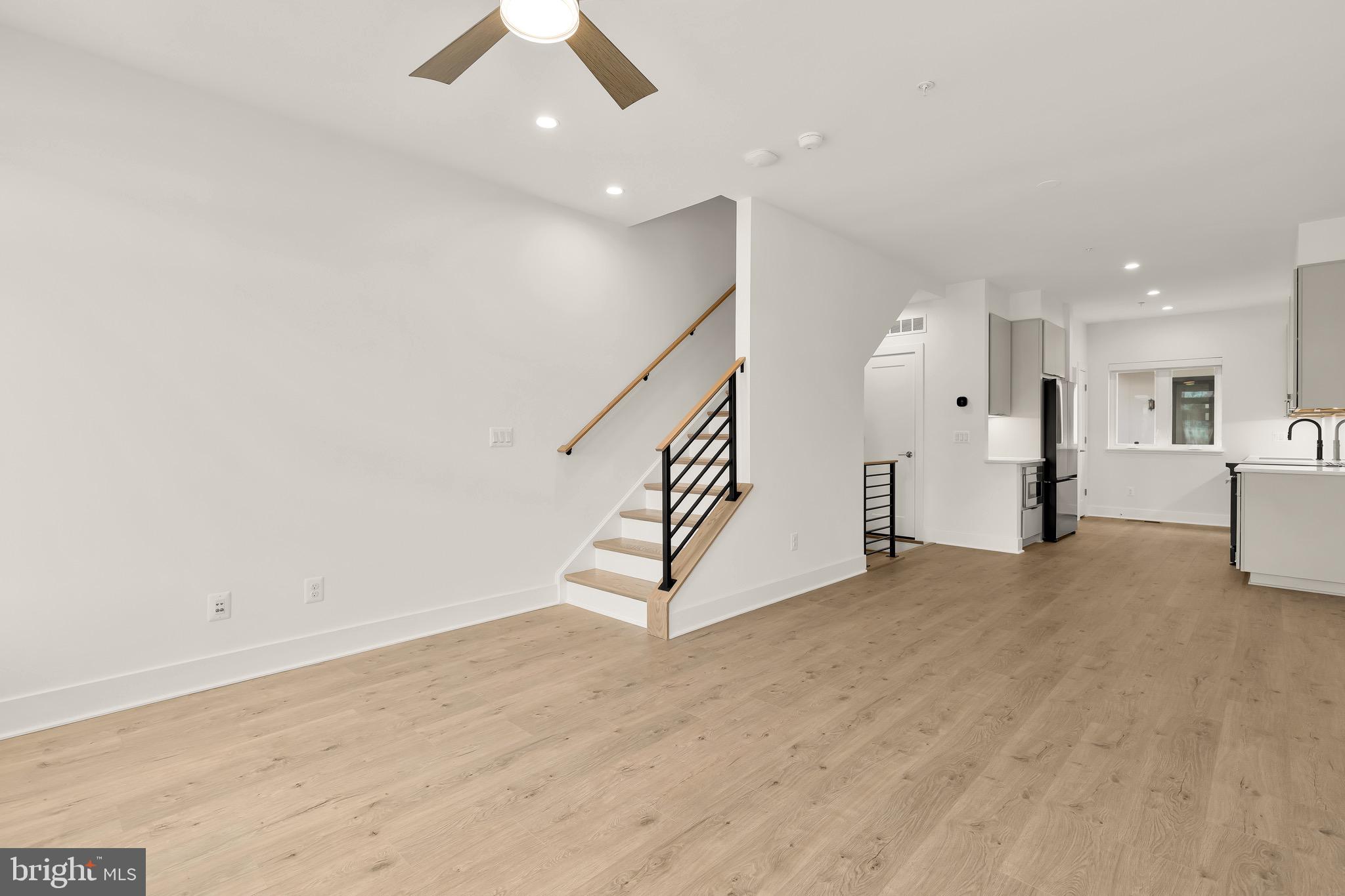 2608 Olmsted Court Northwest Washington, DC 20422 - Photo 22 of 39 a view of an empty room with wooden floor and ceiling fan