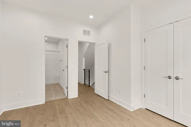 an empty room with windows and wall