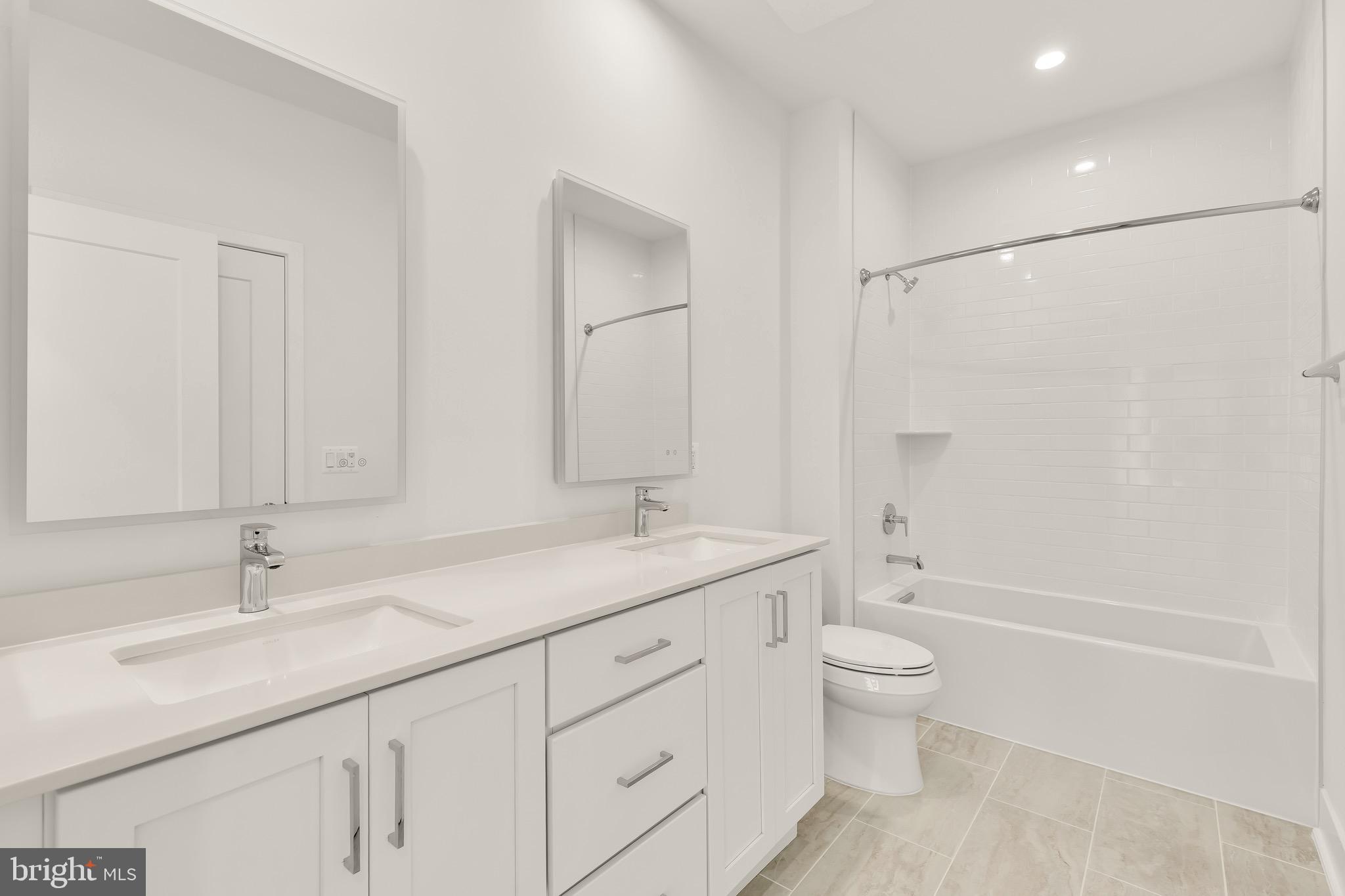 2608 Olmsted Court Northwest Washington, DC 20422 - Photo 27 of 39 a bathroom with a granite countertop sink a toilet and a bathtub