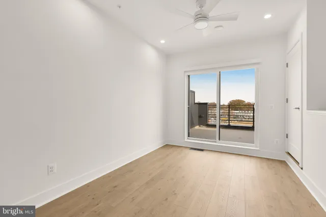 a bathroom with a double vanity sink toilet and a mirror