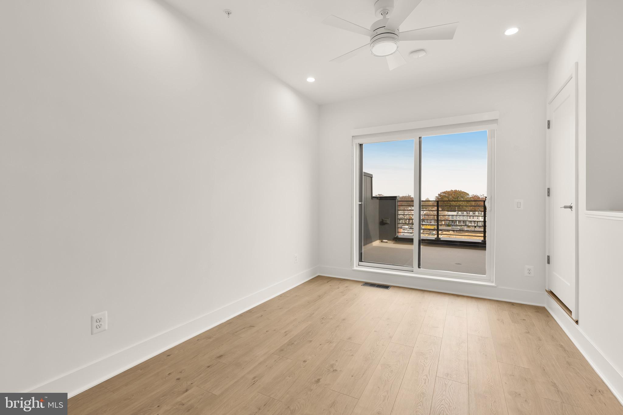 2608 Olmsted Court Northwest Washington, DC 20422 - Photo 31 of 39 an empty room with wooden floor cabinet and windows