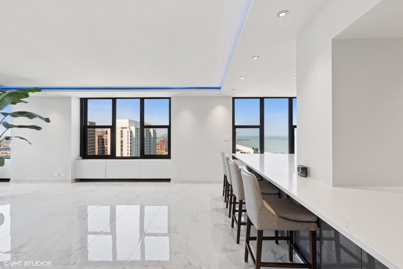 3150 North Lake Shore Drive, Unit 27F Chicago, IL 60657 - Photo 15 of 31 a hallway with a large window and mirror