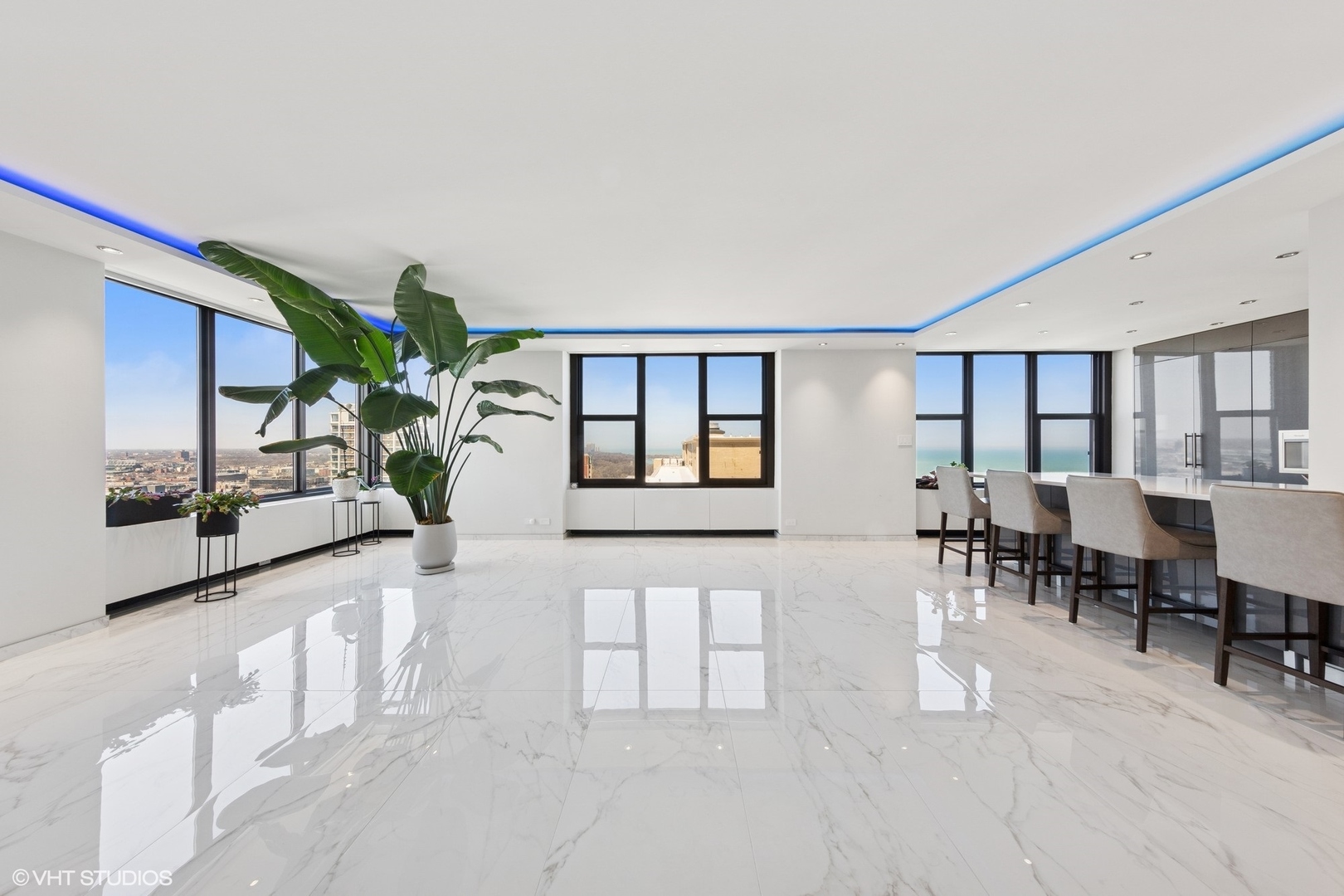 3150 North Lake Shore Drive, Unit 27F Chicago, IL 60657 - Photo 16 of 31 a living room with furniture potted plant and a window