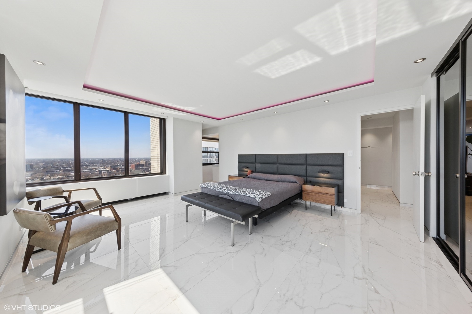 3150 North Lake Shore Drive, Unit 27F Chicago, IL 60657 - Photo 19 of 31 a living room with furniture and a floor to ceiling window