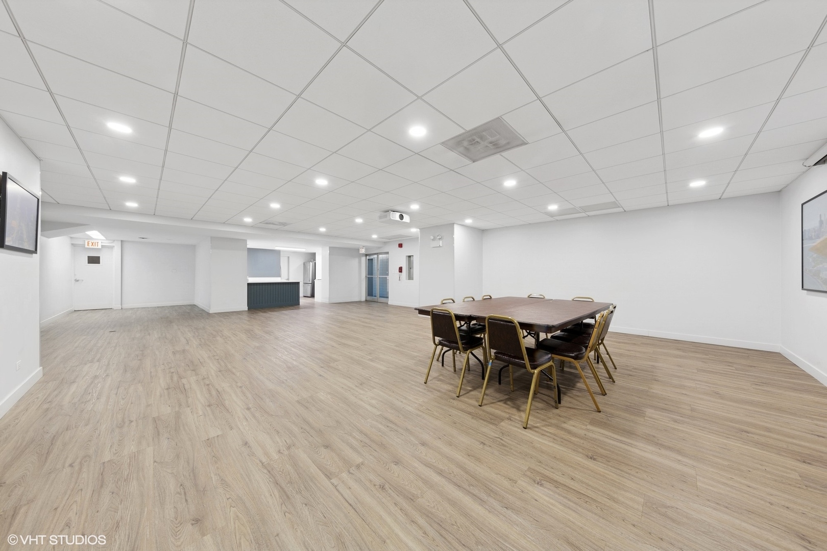 3150 North Lake Shore Drive, Unit 27F Chicago, IL 60657 - Photo 26 of 31 a view of a dining room with furniture and chandelier