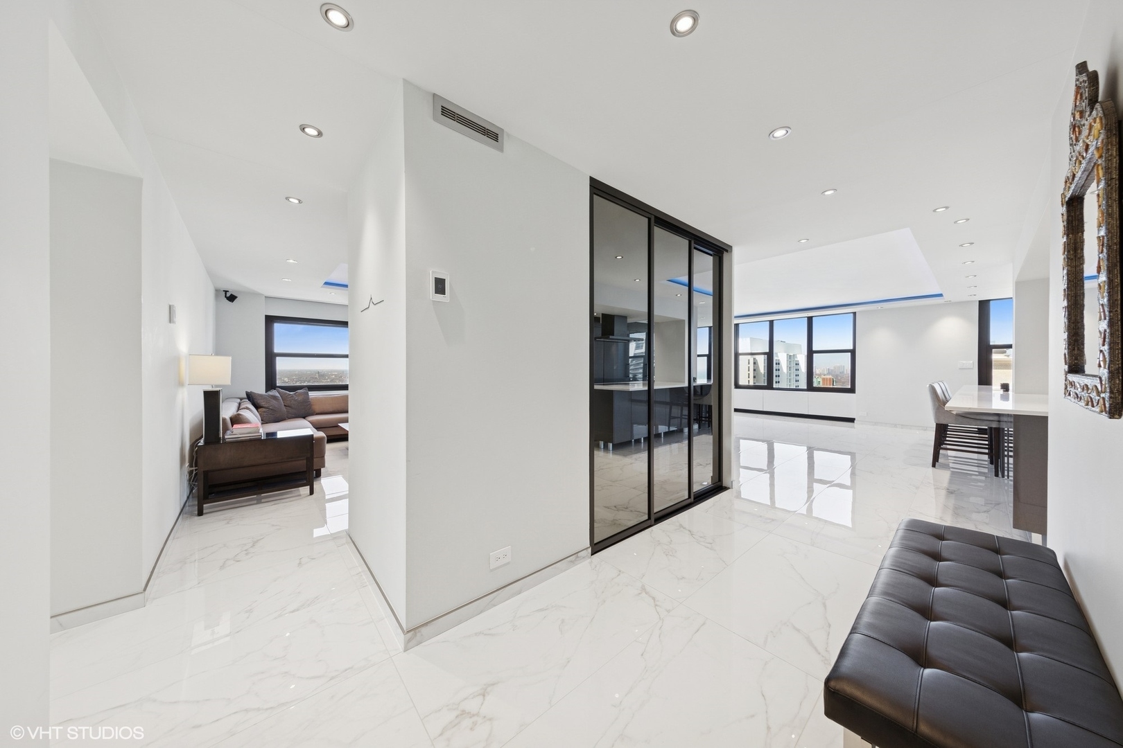3150 North Lake Shore Drive, Unit 27F Chicago, IL 60657 - Photo 3 of 31 a living room with furniture and a wooden floor