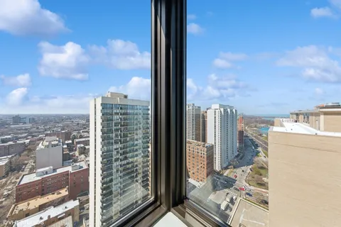 a view of a city from a corridor