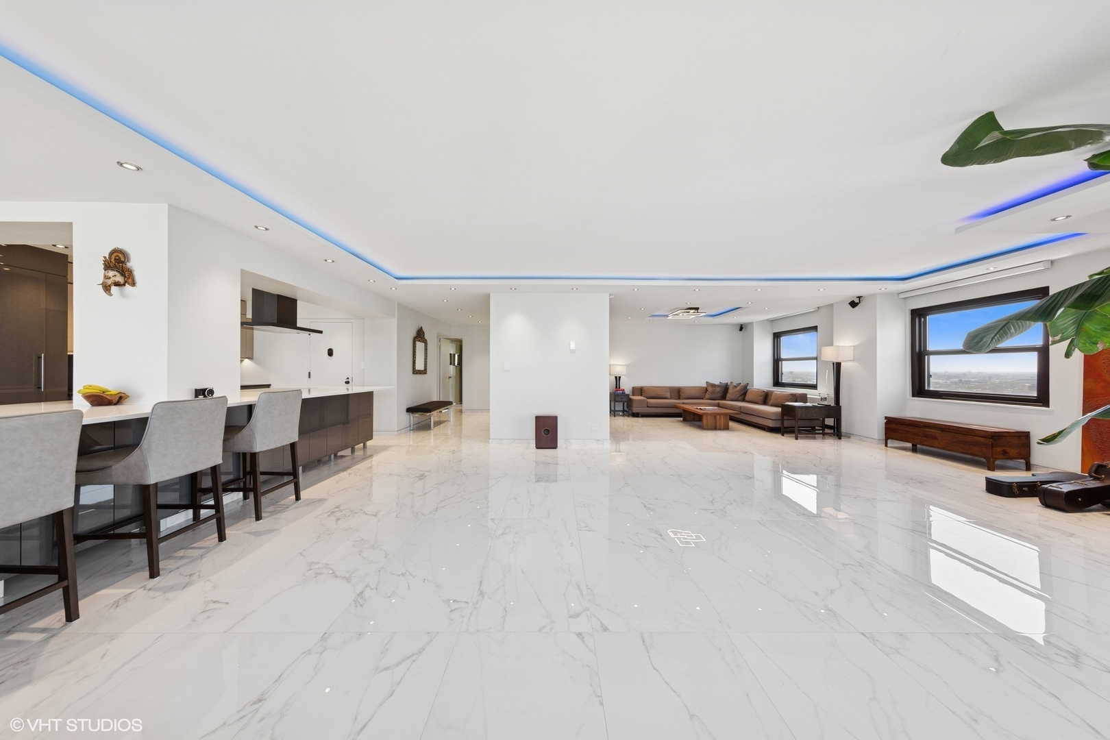 3150 North Lake Shore Drive, Unit 27F Chicago, IL 60657 - Photo 9 of 31 a living room with furniture and a flat screen tv