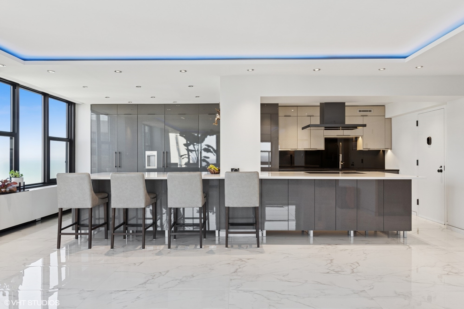 3150 North Lake Shore Drive, Unit 27F Chicago, IL 60657 - Photo 10 of 31 a kitchen with a table and chairs in it