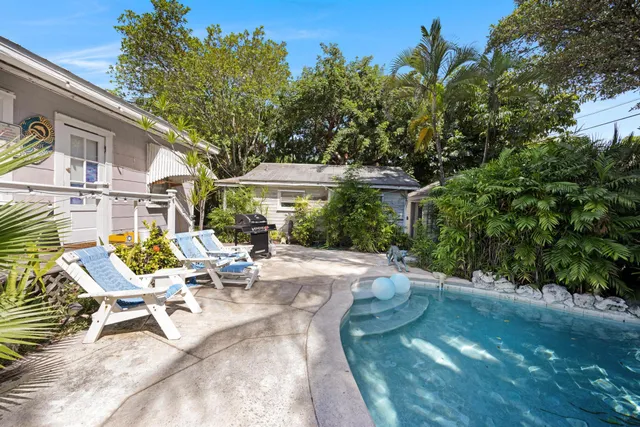 a kitchen with a sink cabinets and appliances