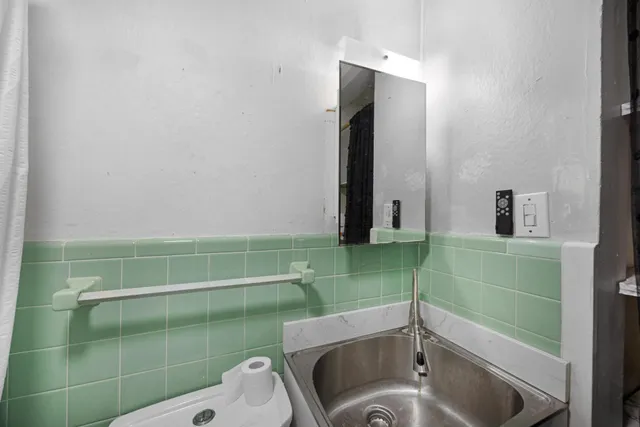 a view of a livingroom with furniture and a chandelier