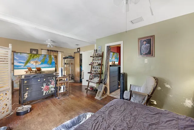 a bathroom with a shower curtain and a toilet