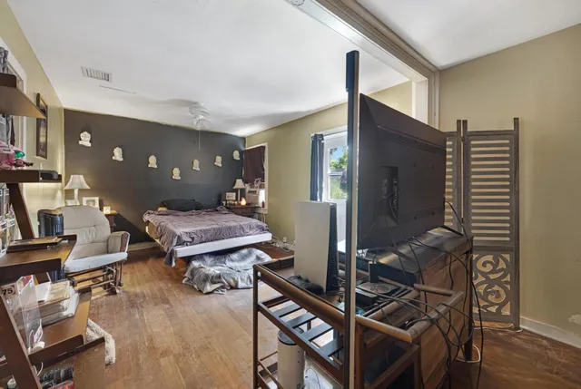 a bedroom with furniture a bed and a window