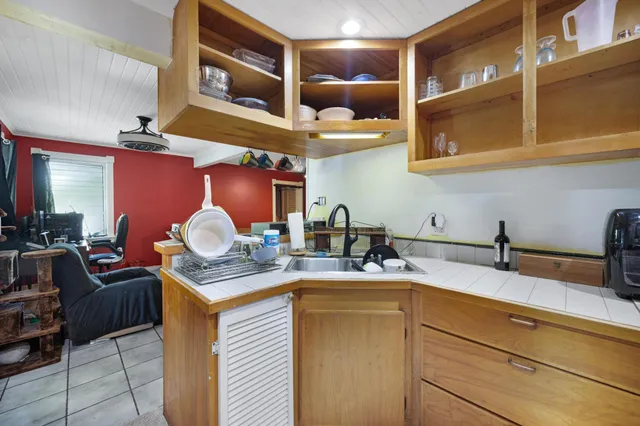 a view of a chair and table in the backyard