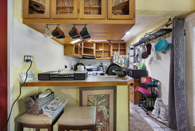 a bathroom with a sink mirror and toilet