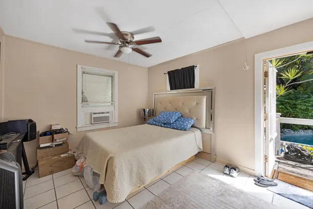 a view of a backyard with plants and a patio