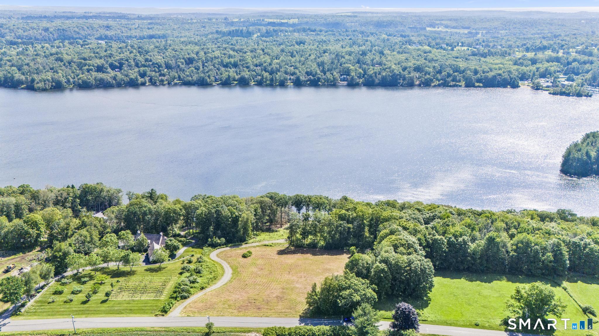 Lot 5 Milton Road Goshen, CT 06756 - Photo 4 of 28 an aerial view of a houses with a yard and lake view