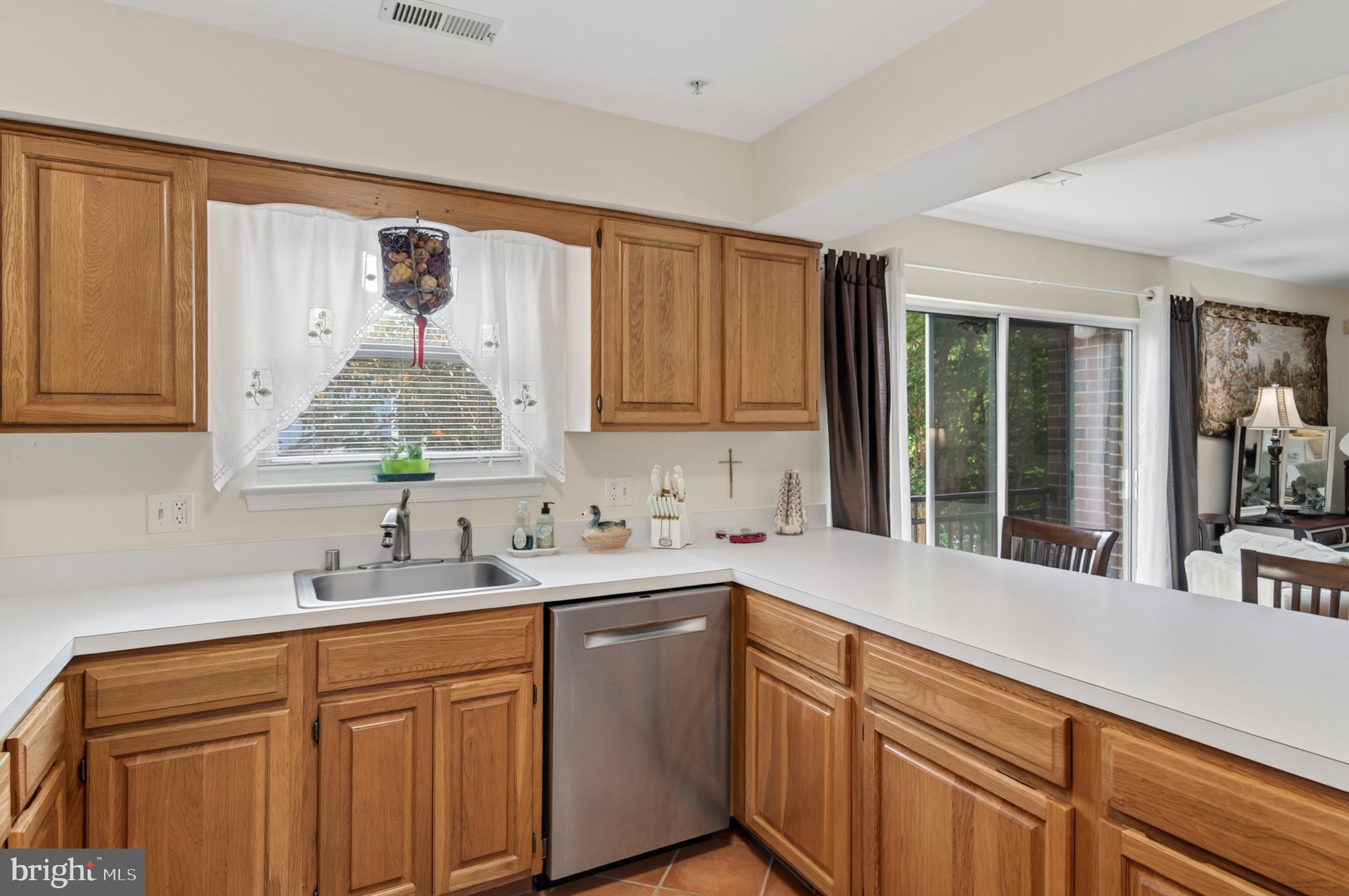936 Bay Ridge Avenue, Unit 201 Annapolis, MD 21403 - Photo 22 of 40 a kitchen with a sink cabinets and window
