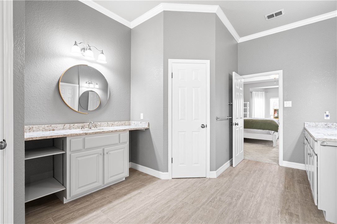 4406 Pontchartrain Drive Corpus Christi, TX 78413 - Photo 18 of 21 a bathroom with a sink and a mirror