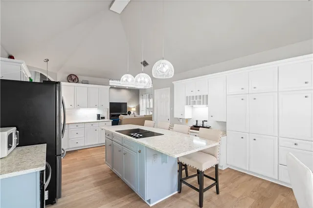 a kitchen with a refrigerator a stove a sink and a refrigerator