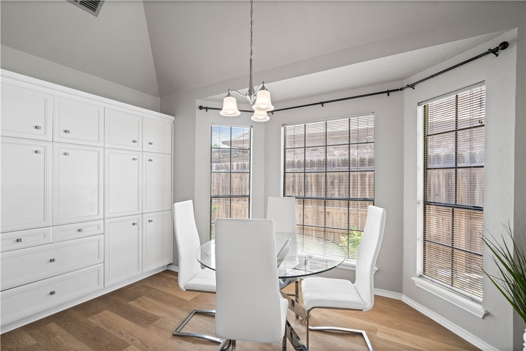 4406 Pontchartrain Drive Corpus Christi, TX 78413 - Photo 6 of 21 a view of a dining room with furniture large windows and wooden floor