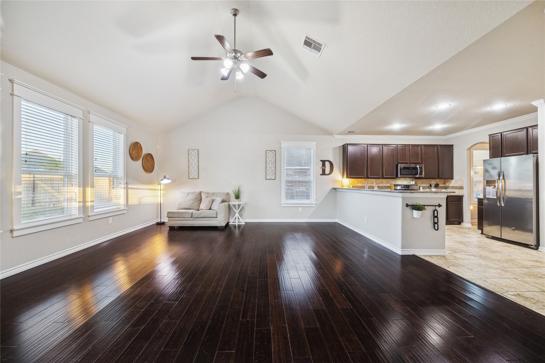 3026 Currier Court Rosenberg, TX 77471 - Photo 11 of 22 a living room with couches and kitchen view with wooden floor