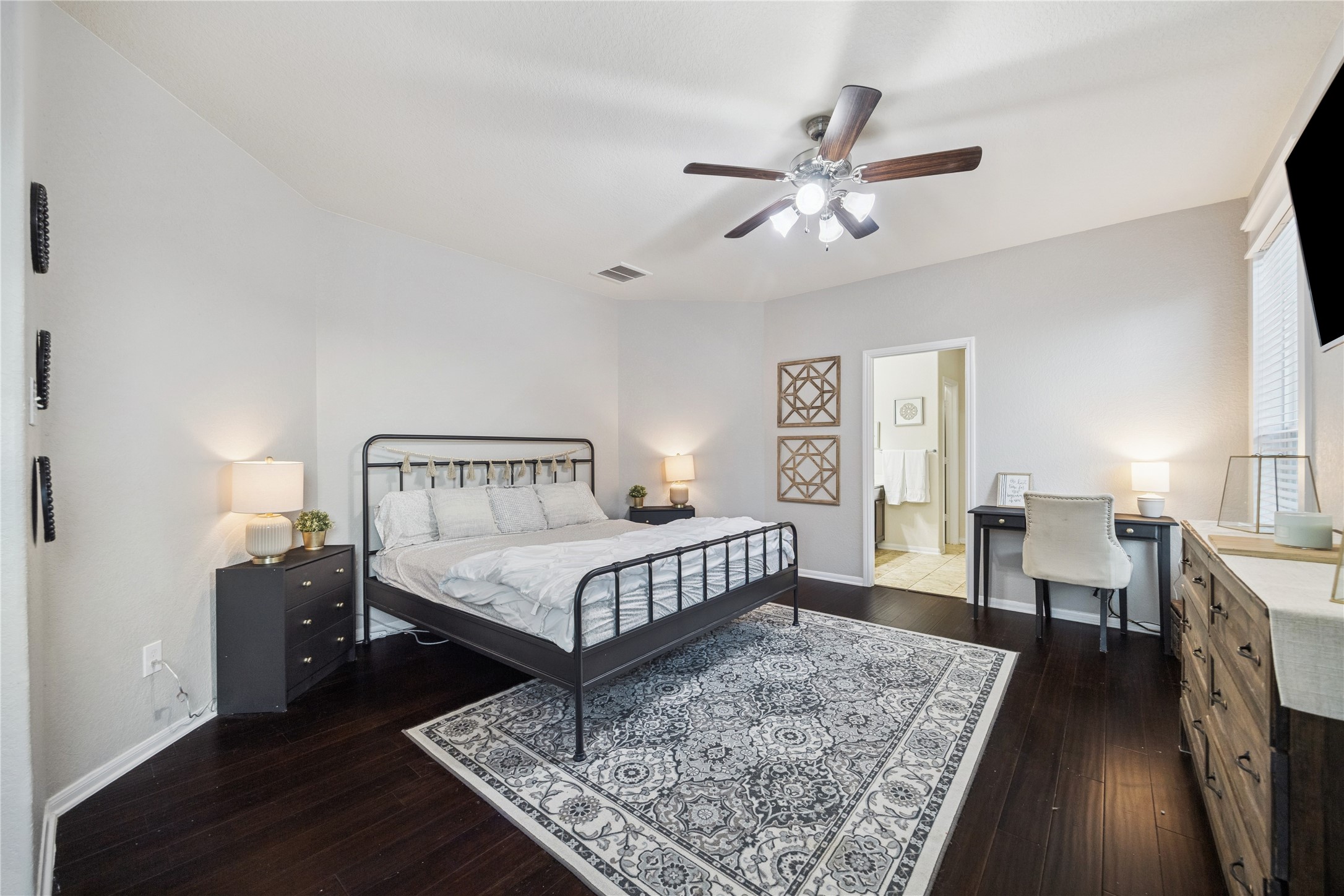 3026 Currier Court Rosenberg, TX 77471 - Photo 13 of 22 a bedroom with a bed a mirror and furniture