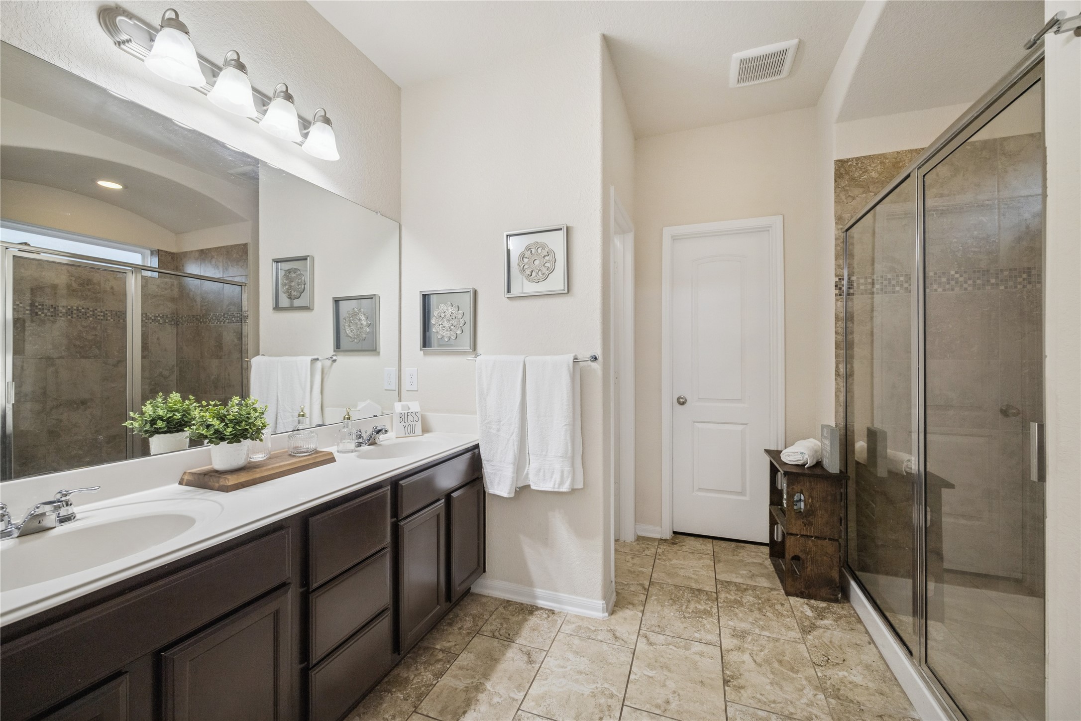 3026 Currier Court Rosenberg, TX 77471 - Photo 15 of 22 a spacious bathroom with a double vanity sink a mirror and a shower